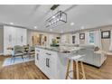 Spacious open kitchen and living room with a large granite island at 2271 Columbia Dr, Decatur, GA 30032