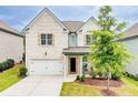 Charming two-story home with a white brick facade, attached garage, and a well-maintained landscaped yard at 1250 Grove Pkwy, Jonesboro, GA 30236