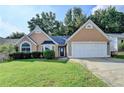 Charming home with a well-manicured lawn and two-car garage at 3625 Ennfield Lane Ln, Duluth, GA 30096