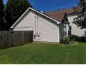 Side view of home showcasing the well-maintained lawn and manicured garden at 857 Asbury Trl, Lithonia, GA 30058