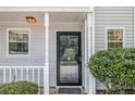Close-up of the front entrance, showcasing the storm door and inviting facade at 2376 Wellington Cir, Lithonia, GA 30058