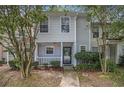 Cozy townhome with a covered entrance and lush greenery at 2376 Wellington Cir, Lithonia, GA 30058