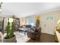 Comfortable living room featuring hardwood floors, a cozy sectional, and an abundance of natural light at 1091 Napier St, Atlanta, GA 30316