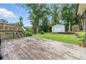 Expansive backyard with deck and shed providing ample space for outdoor activities at 4829 Caboose Nw Ln, Acworth, GA 30102