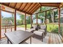 Relaxing screened porch with comfortable seating and scenic backyard views at 4829 Caboose Nw Ln, Acworth, GA 30102