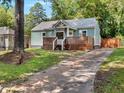Charming home featuring a stylish deck, a well-maintained lawn, and a cozy, inviting exterior at 2197 Jernigan Dr, Atlanta, GA 30315
