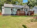 Charming home featuring a stylish deck, a well-maintained lawn, and a cozy, inviting exterior at 2197 Jernigan Dr, Atlanta, GA 30315