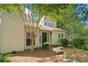 Charming home featuring a well-manicured yard, lush trees, and a welcoming exterior at 837 Serramonte Dr, Marietta, GA 30068