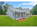 Beautiful home with side porch, landscaping, and a well-maintained lawn at 1943 Lake Chase Ln, Jonesboro, GA 30236