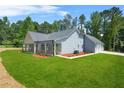 Spacious home with attractive curb appeal, side lawn, and garage at 1943 Lake Chase Ln, Jonesboro, GA 30236