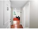 Bright hallway leading into a living space with hardwood floors and natural light at 2965 Pharr Court South Nw # 1-110, Atlanta, GA 30305