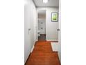 Hallway with hardwood floors leading to a full bathroom at 2965 Pharr Court South Nw # 1-110, Atlanta, GA 30305