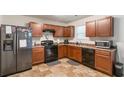 Well-equipped kitchen with dark cabinetry, modern appliances, and functional layout at 5622 Laurel Ridge Dr, Atlanta, GA 30344
