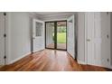 Bright entryway with hardwood floors and double doors leading to the porch at 4370 Mabry Ln, Roswell, GA 30075