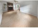 Spacious living room with hardwood floors and a brick fireplace at 4023 Oak Crest Dr, Tucker, GA 30084