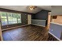 Inviting living room with vaulted ceiling, wood-look flooring, and plenty of natural light at 101 Tide Water Way, Rockmart, GA 30153