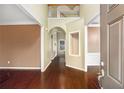 Spacious foyer features hardwood floors, a two-story ceiling, and decorative alcove at 1883 Jameson Cir, Lawrenceville, GA 30043