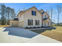 Charming two-story home with attached garage and long driveway at 161 Haverling Pass, Hampton, GA 30228