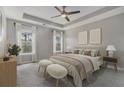 Serene main bedroom with tray ceiling, plush carpet, and neutral décor at 407 Mountain View Ln, Woodstock, GA 30188