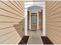 Charming front entryway with stone accents, covered porch, and a view into the home at 1795 Waterside Nw Dr, Kennesaw, GA 30152