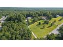 Aerial view of a large home on a large lot with mature trees and a long drive at 450 Ledbetter Rd, Villa Rica, GA 30180