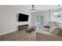 Comfortable living room with a couch, television, and sliding doors at 1081 Liberty Nw Pkwy, Atlanta, GA 30318