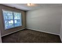 Neutral bedroom with carpet, a window providing light, and an inviting atmosphere at 2565 Rainmaker Dr, Decatur, GA 30034