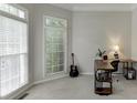 Bright office space with natural light from windows, cozy carpet, and a functional desk setup at 4085 Creekview Ridge Dr, Buford, GA 30518