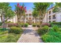 Beautiful exterior view of a charming building with lush landscaping at 955 Juniper Ne St # 4127, Atlanta, GA 30309