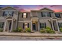 Attractive townhome with manicured landscaping, neutral siding, and black shutters at 4043 Avalon Sw Rd, Atlanta, GA 30331