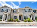 Charming townhome with neutral siding, black shutters, and well-kept landscaping at 4043 Avalon Sw Rd, Atlanta, GA 30331