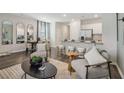 Open-concept living space with a view into the kitchen and dining area, furnished with modern pieces at 1402 Sweetshrub Pl # 32, Atlanta, GA 30318