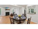 Inviting dining area with hardwood flooring, wainscoting and backyard view at 3961 Riverlook Se Pkwy # 209, Marietta, GA 30067