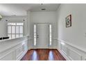 Inviting entryway with wood floors, classic trim, and a front door flanked by sidelights at 337 Inverness Ave, Mcdonough, GA 30253