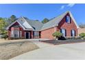 Beautiful red brick home with mature landscaping, manicured lawn and concrete driveway at 337 Inverness Ave, Mcdonough, GA 30253