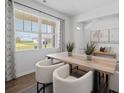 Well lit dining room has an eye-pleasing view of the outdoors at 2733 Montie Ct, Lithia Springs, GA 30122