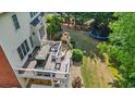 Elevated deck with fireplace overlooking the backyard and trampoline at 1140 Promontory Drive, Marietta, GA 30062