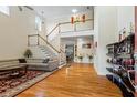 Grand foyer with high ceilings, hardwood floors, staircase, and elegant decor at 1140 Promontory Drive, Marietta, GA 30062