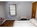 Bright bedroom with laminate flooring, closet, and natural light; ideal for relaxation at 88 Greene Ne St, Fairburn, GA 30213