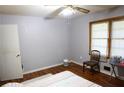 Cozy bedroom with wood floors, soft gray walls, and natural light from the window at 88 Greene Ne St, Fairburn, GA 30213