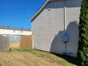 Side yard of home with wood fence and space for outdoor activities at 1625 Conley Rd # 229, Conley, GA 30288