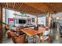 Open living space featuring a dining area, exposed brick, and views of the modern kitchen at 170 Boulevard Se # H-221, Atlanta, GA 30312