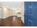 Spacious living room with hardwood floors, an open view of kitchen and sliding barn door detail at 1975 Glenmar Dr, Decatur, GA 30032
