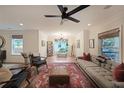 Spacious living room with a grey sofa, hardwood floors, and modern decor at 1791 N Olympian Way, Atlanta, GA 30310
