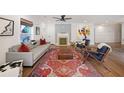 Bright living room with a decorative fireplace and a large ornate rug at 1791 N Olympian Way, Atlanta, GA 30310