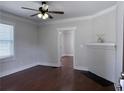 Bright living room with hardwood floors, white trim, and a decorative fireplace at 1647 Walker Ave, Atlanta, GA 30337