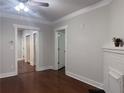 Bright living room with hardwood floors, white trim, and a decorative fireplace at 1647 Walker Ave, Atlanta, GA 30337