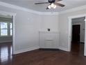 Bright living room with hardwood floors, white trim, and a decorative fireplace at 1647 Walker Ave, Atlanta, GA 30337