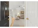 View from entryway into living room with neutral paint and light-colored furnishings at 620 Granville Ct, Sandy Springs, GA 30328