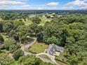Aerial view of a home nestled among lush green trees with a golf course nearby at 2830 Alston Drive Se Dr, Atlanta, GA 30317
